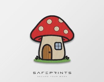 May include: Embroidered patch featuring a whimsical mushroom house with a red cap dotted with white spots. The house has a tan body, a brown door, and a small blue window, set on a patch of green grass. The text "SAFEPRINTS SECURE YOUR MARK" is at the bottom.