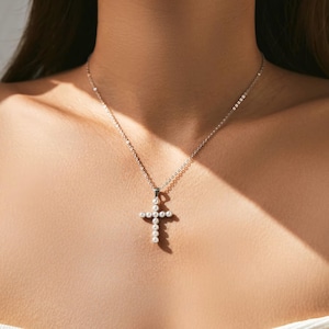 White pearl cross pendant necklace in sterling silver