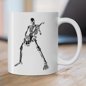 Skeleton Playing Guitar Mug Spooky Rocker Gift Halloween Metalhead Coffee Cup Goth Rock Band Present for Gothic Metal Music Lover