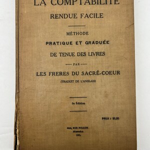 May include: A vintage book cover with the title "La Comptabilité Rendue Facile" in French. The book is a practical and graduated method for keeping books, written by the Frères du Sacré-Coeur and translated from English. The cover is beige with black text and the book was published in 1931.