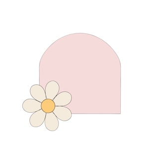May include: A pink arched shape with a white daisy with a yellow centre.