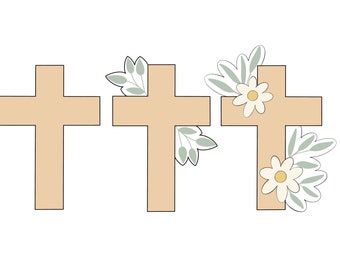May include: Three wooden crosses, one with a simple design, one with a single sprig of leaves, and one with a sprig of leaves and a white daisy.