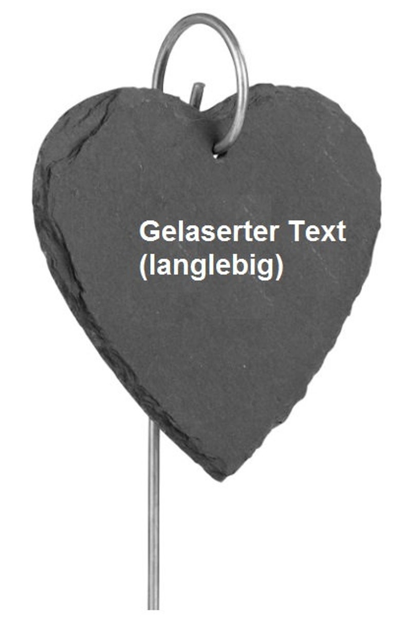 May include: A black heart-shaped slate plaque with a metal ring at the top and a metal stake on the bottom. The plaque has the text "Gelaserter Text (langlebig)" engraved on it.
