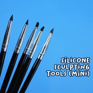 May include: A set of six black-handled silicone sculpting tools with silver ferrules and black tips, against a bright blue background. The text "SILICONE SCULPTING TOOLS (MINI)" is in white on the right side.