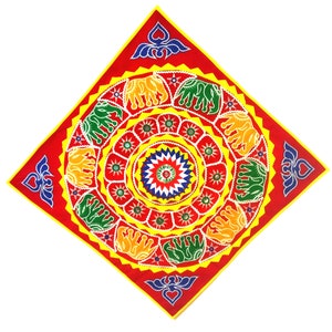 May include: A red square fabric wall hanging with a circular design featuring yellow, green, blue, and white geometric patterns. The center of the design has a starburst pattern with a red, white, and blue color scheme.