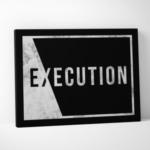 May include: Black canvas art print with the word "EXECUTION" in white, bold, sans-serif font. The word is centered on the canvas, with a white, angled shape on the left side. The canvas has a black border.