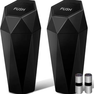 May include: Two black diamond-shaped trash cans with a push top lid. The trash cans are made of a hard plastic and have a sleek, modern design.