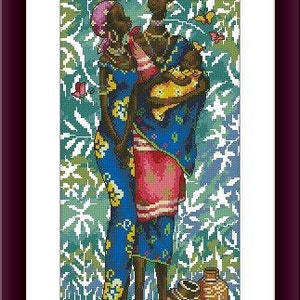 May include: A framed cross-stitch embroidery depicting two figures standing together, one holding a baby. The figures wear blue and pink patterned garments. The background features green and white foliage patterns, with small butterflies and two brown pottery vessels at the base.