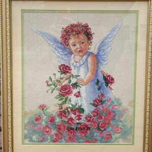 May include: A white ceramic mug with a black handle and the text "But First, Coffee" in a bold, black font. The mug is set against a blurred background, suggesting a cozy setting. The mug appears to be approximately 4 inches tall.