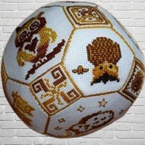 May include: A white and brown owl-themed ball with a geometric pattern. The ball is made of fabric and has a 3D design.