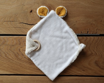 Very soft customizable comforter, in swaddle and faux sheep fur, and teething ring