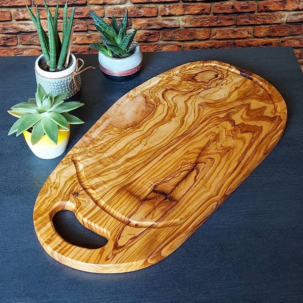 Tagliere da intaglio, tagliere da bistecca, con scanalatura per il succo e cinghia di presa in legno d'ulivo, lunghezza 40, 50 cm selezionabile, tagliere da portata, tagliere