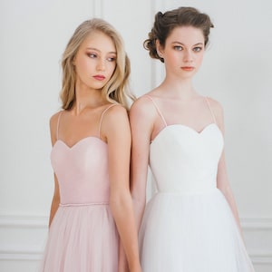 A line pink wedding dress, A line off-white wedding dress, a corset wedding dress, delicate handmade drapery on the corset, a thin waistbamd with pearls and crystals, spaghetti straps, soft tulle skirt without a train