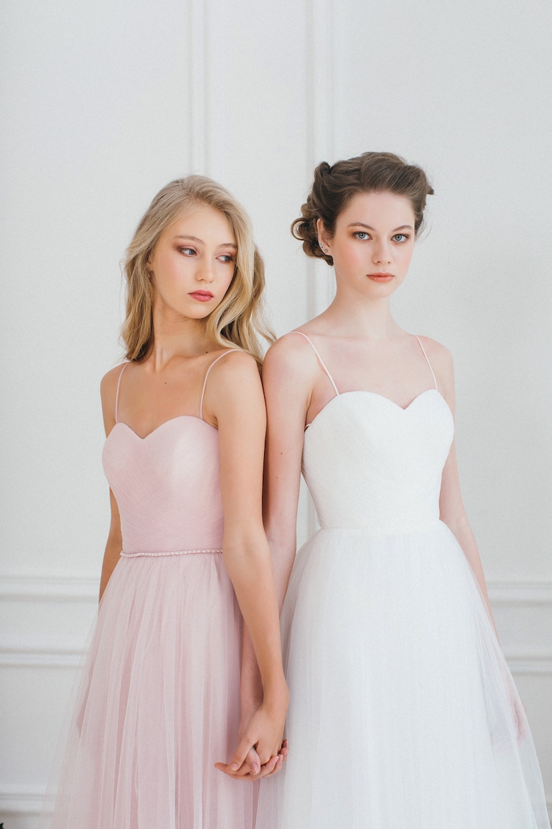 A line pink wedding dress, A line off-white wedding dress, a corset wedding dress, delicate handmade drapery on the corset, a thin waistbamd with pearls and crystals, spaghetti straps, soft tulle skirt without a train