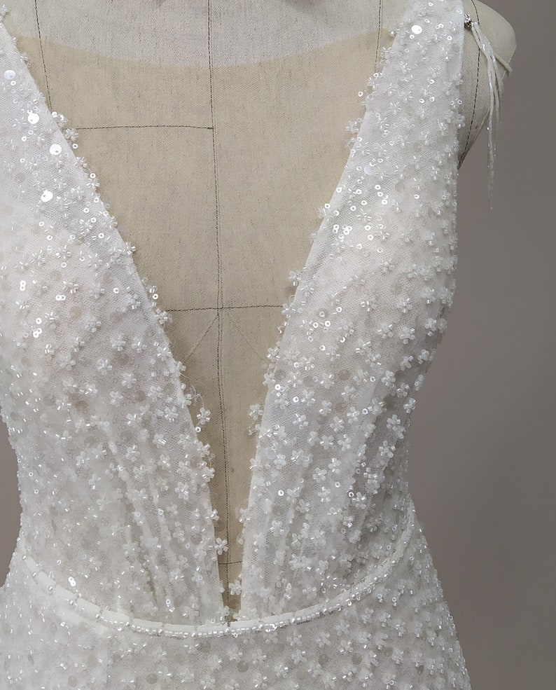 beaded wedding dress, mermaid bridal dress, sleeveless, beaded mesh fabric, shiny wedding dress, deep V neckline with transparent nude mesh, thin waistband is embroidered with tiny beads