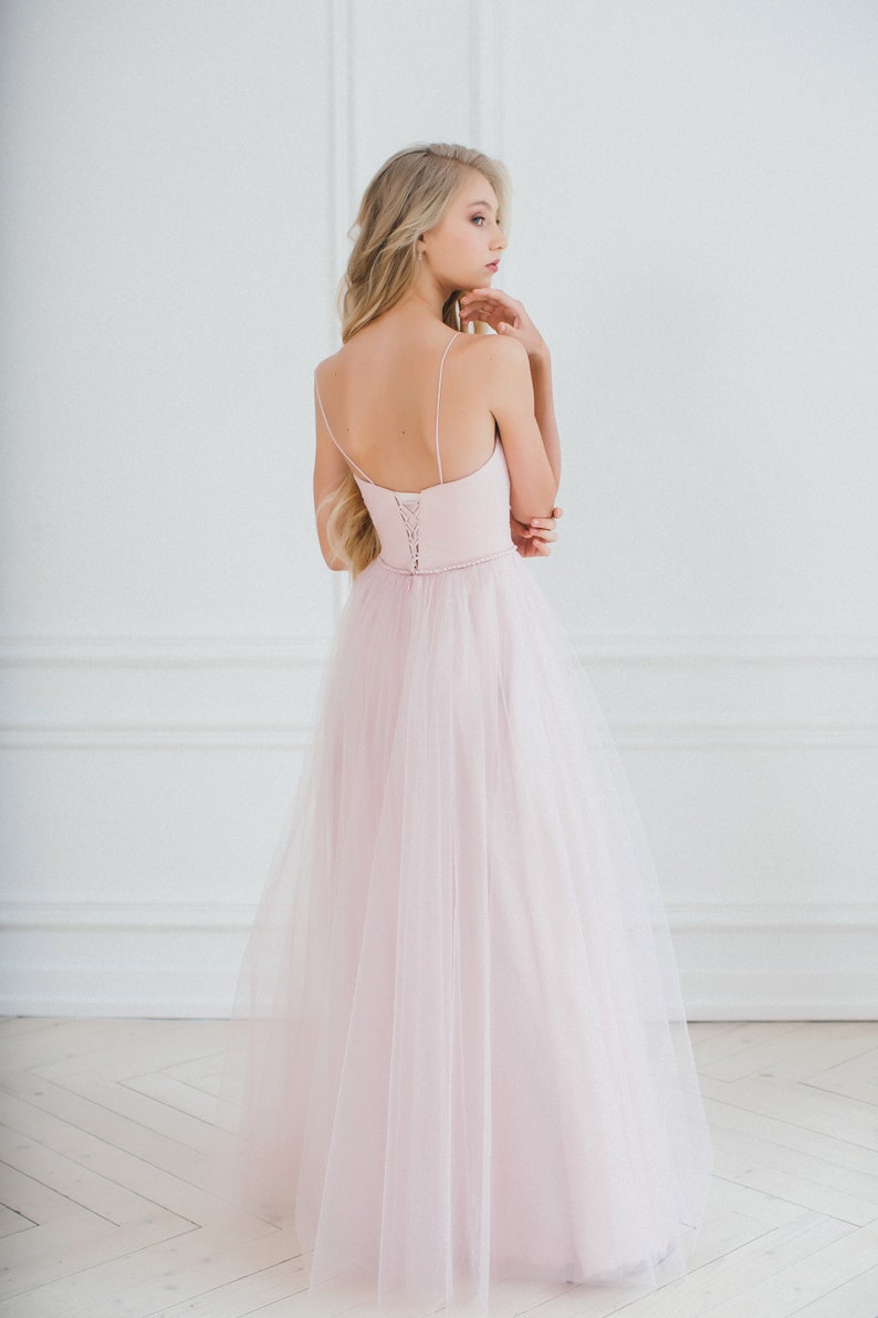 A line wedding dress, pink wedding dress, simple wedding dress, corset wedding dress, open shoulder wedding dress, spaghetti straps, a ribbon fastening on the back, a thin waistband is embroidered with crystals and pearls
