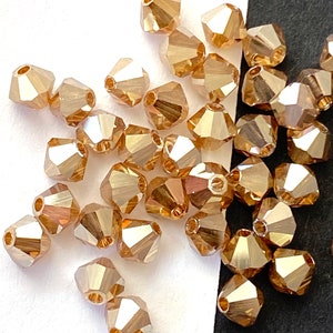 Golden Flare Bicone faceted beads, Czech Preciosa gold crystal beads, reflective gold pyramid beads