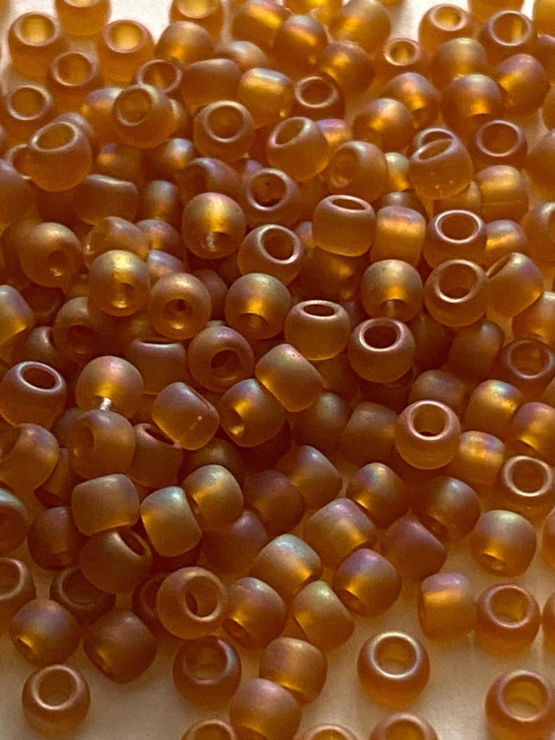 Toho #8 Matte with Rainbow Coating Seed Bead Topaz Dark