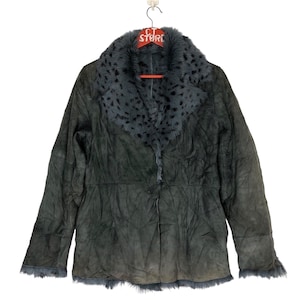 May include: A dark gray suede jacket with a faux fur collar featuring a leopard print pattern. The jacket has a button closure and long sleeves.