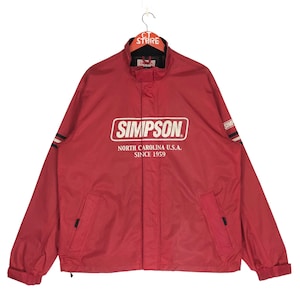 May include: A red zippered jacket with the Simpson logo and the text "North Carolina U.S.A. Since 1959".