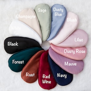 May include: A variety of colors of sleep masks, including sage, dusty blue, champagne, blush, white, lilac, black, dusty rose, forest, mauve, rust, red wine, and navy.