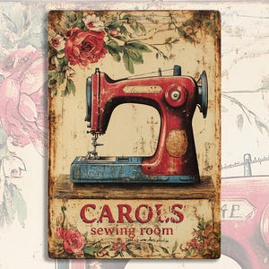 May include: Vintage-style metal sign with a red sewing machine and floral accents. The sign reads "Carol's Sewing Room".
