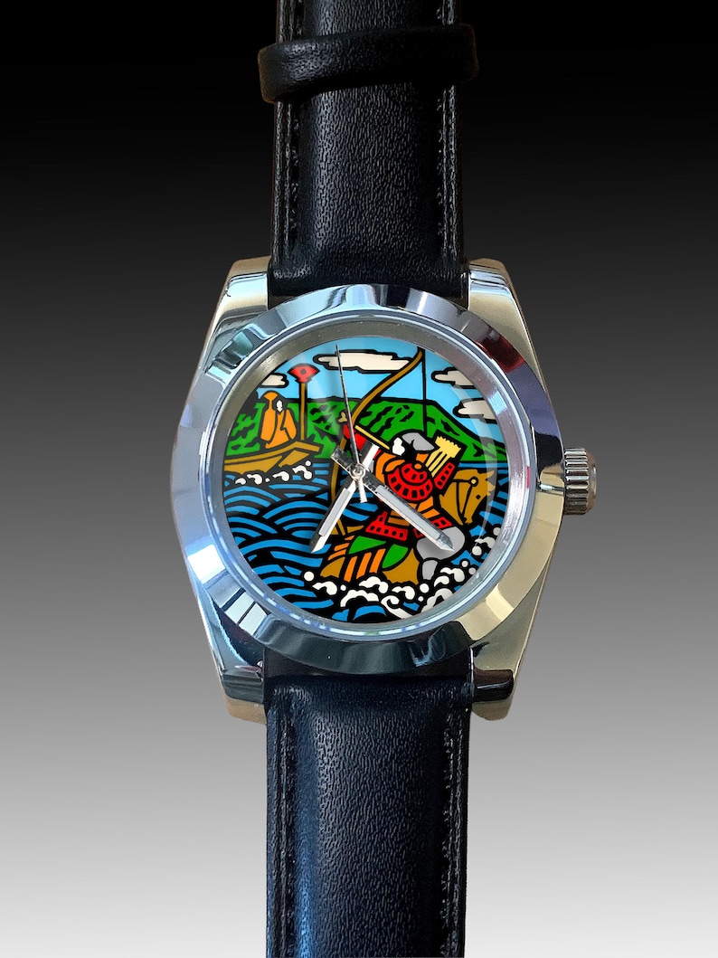 May include: A stainless steel wristwatch with a black leather band. The watch face features a colorful illustration of a person in a boat with a bow and arrow, with a mountain and water scene in the background.