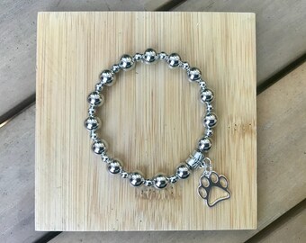 Go Dog!  Silver Beaded 8” Elastic Bracelet with Paw Charm.