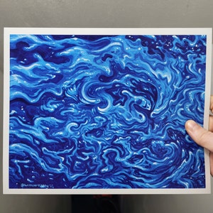 May include: Abstract painting of swirling blue and white paint. The painting has a textured look and is reminiscent of water.