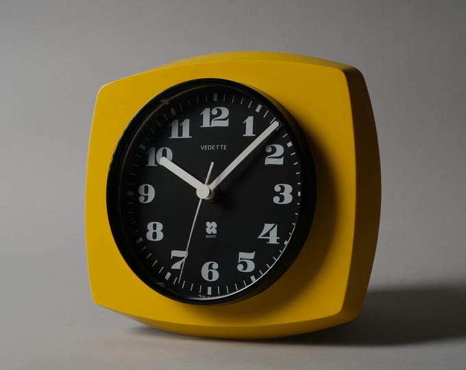 Vedette France Yellow Plastic Wall Clock, French Space Age Design, 1970s.