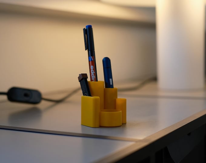 Vintage 1970s 'M&M Baby Boy' yellow plastic multipurpose desk caddy, new in box.