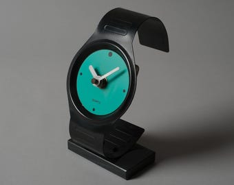 Postmodern Memphis Style Table Clock in Wristwatch Form, Turquoise Dial, 1980s Vintage.