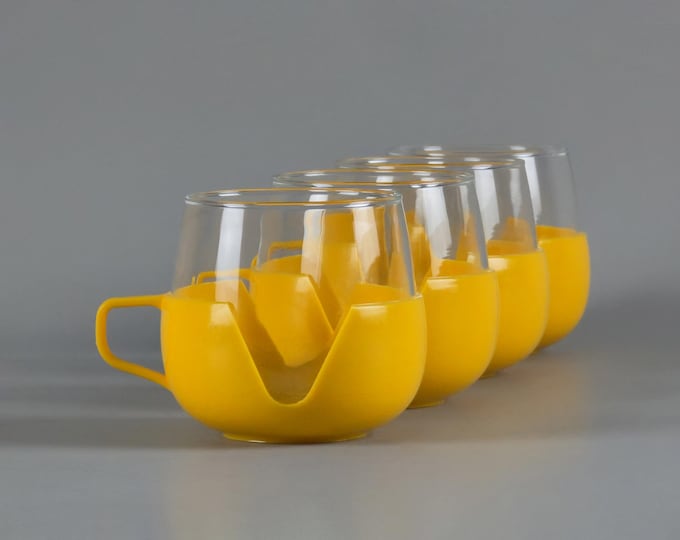 1970s Space Age Design Set Of 4 Glass Tea Cups With Yellow Casing.