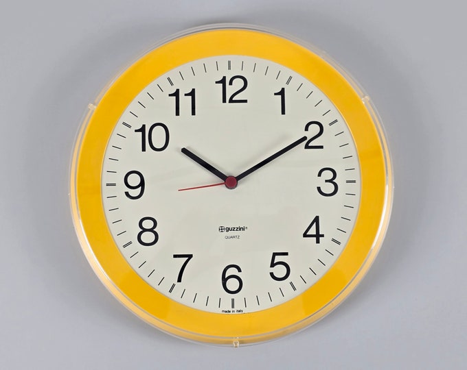 Postmodern Design - Vintage GUZZINI Yellow Plastic Wall Clock - Designed By Bruno Gecchelin - Italy, 1980s.