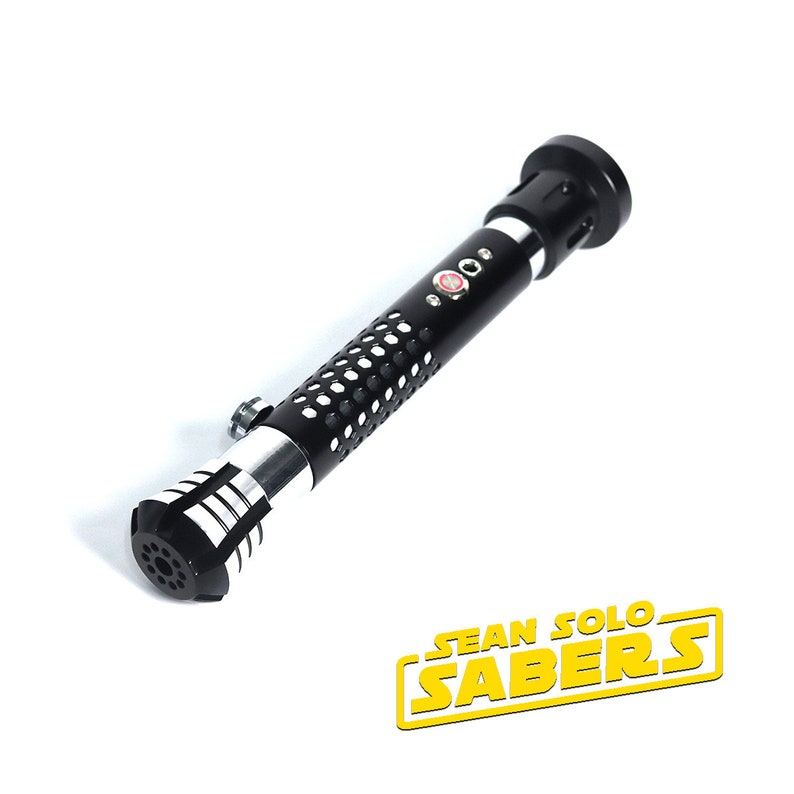 May include: Black lightsaber hilt with a silver band and a textured black grip. The hilt has a red button and a small hole on the side. The hilt is labeled "SEAN SOLO SABERS".