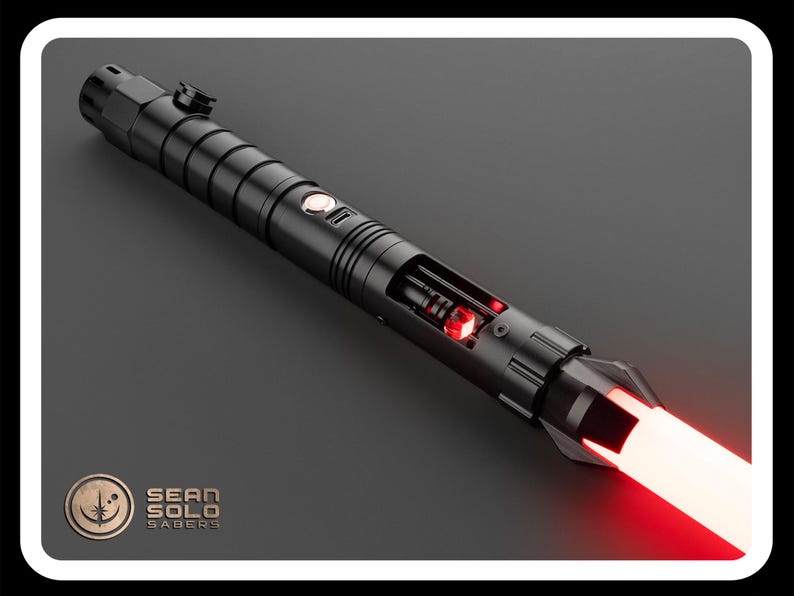 May include: A black lightsaber with a red blade. The lightsaber is partially disassembled, revealing the internal components. The lightsaber is labeled "Sean Solo Sabers".