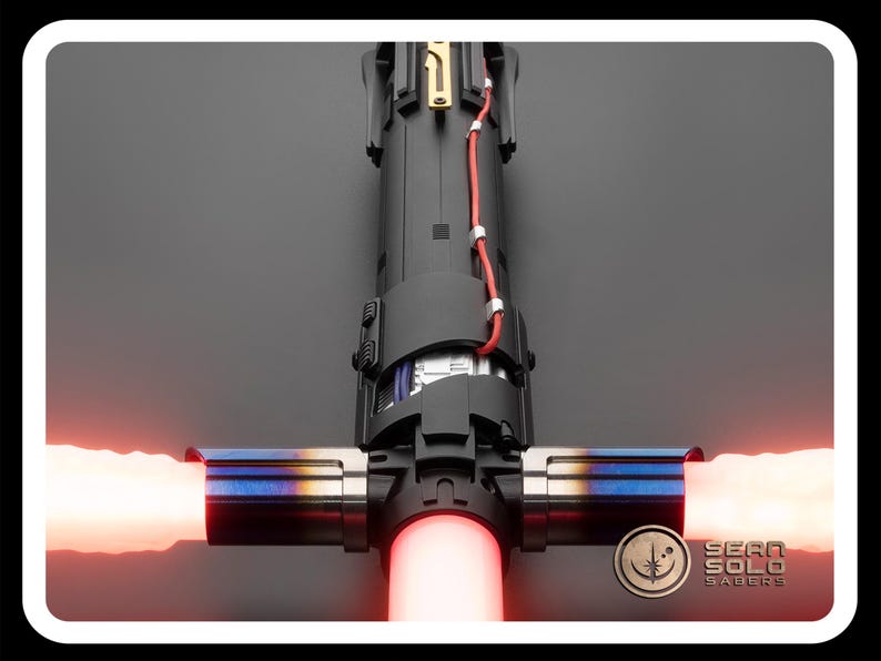 May include: A red lightsaber with a black and silver hilt. The lightsaber is ignited and the blade is red. The hilt has a black handle with a silver band and a silver button. The lightsaber is on a black background.