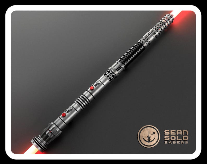 May include: A double-bladed lightsaber with a metallic silver and black hilt featuring intricate perforated detailing, ribbed grip sections, and two prominent red activation buttons. The weapon emits glowing red light from both ends. Sean Solo Sabers logo.