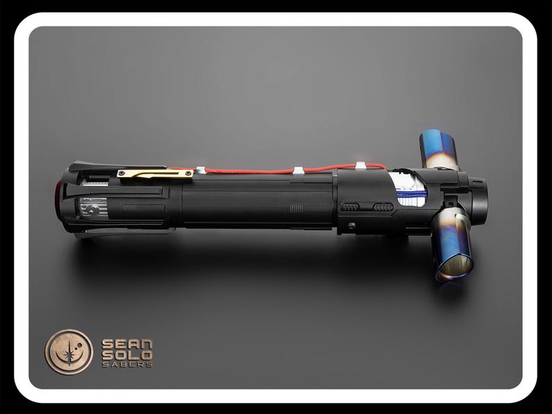 May include: A black lightsaber with a red wire and blue exhaust ports. The lightsaber is made by Sean Solo Sabers.