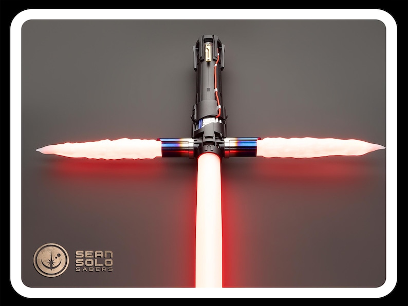 May include: A red lightsaber with a black hilt and a crossguard. The lightsaber is lit and the blades are extended. The lightsaber is on a gray background. The text "SEAN SOLO SABERS" is visible in the lower left corner of the image.