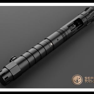 May include: A black lightsaber hilt with a detailed design and a removable blade. The hilt has a textured surface and a silver accent. The hilt is made of metal and has a sleek, modern design.