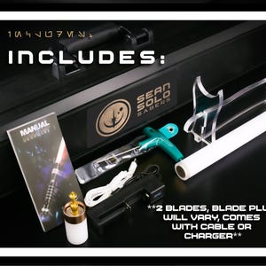 May include: A black carrying case with the text INCLUDES: and SEAN SOLO SABERS, a manual, a teal T-handle hex key, a white cylindrical blade plug, a black battery charger with a white cable, and a clear acrylic stand for a white light saber blade.