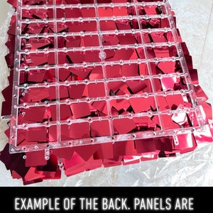 May include: A clear plastic grid with attached red square sequins. The text at the bottom reads: EXAMPLE OF THE BACK. PANELS ARE TO BE CLIPPED TOGETHER.