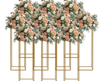 May include: Set of eight gold metal flower stands with artificial flower arrangements in shades of peach and white. The stands are square and have a simple design.