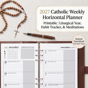 May include: A 2027 Catholic Weekly Horizontal Planner printable with a habit tracker and meditations. The open planner is inside a brown leather binder, accompanied by two wooden rosaries, three fountain pens, and a small brown leather journal.