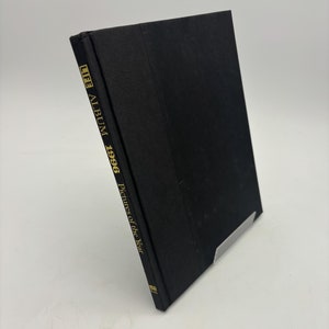 May include: A black hardcover book titled "LIFE ALBUM 1996 Pictures of the Year".