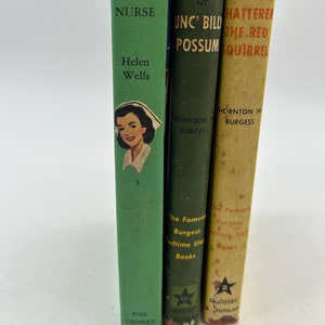 May include: Three vintage children's books with green and yellow covers. The books are titled "Cherry Ames Army Nurse", "The Adventures of Unc' Billy Possum", and "The Adventures of Hattery the Red Squirrel".