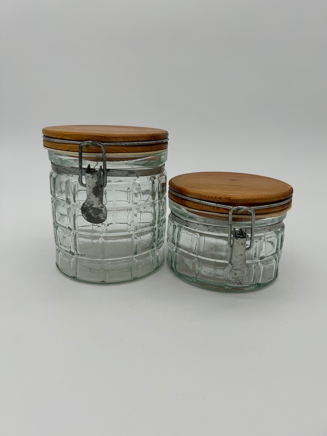 Pair of Vintage Clear Glass Canisters With Clamp Style Wood Lids