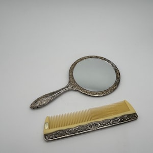 Vintage Ornate Silver Plated Vanity Hand Mirror and Comb Set. Made in Hong Kong