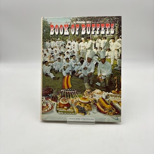 May include: A vintage cookbook titled "Book of Buffets" with a cover featuring a group of chefs and a display of food. The cover has the text "The Professional Chef's" above the title. The book is on a white background.